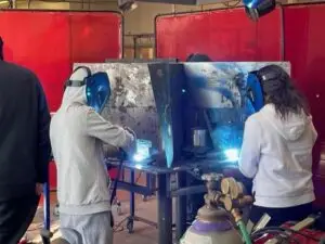 Middle School Students learning welding during Trades Exploration workshops