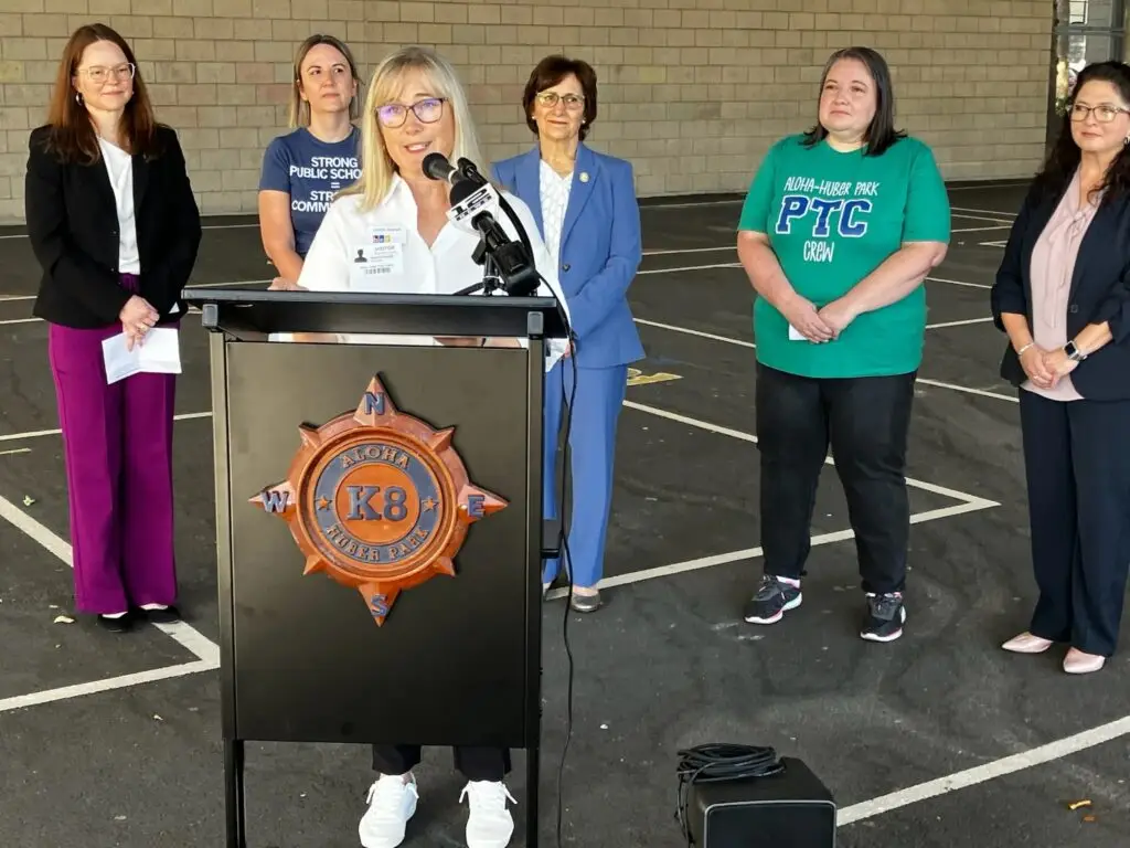 Beaverton Education Foundation Executive Director Lauren Garrett speaking at a podium