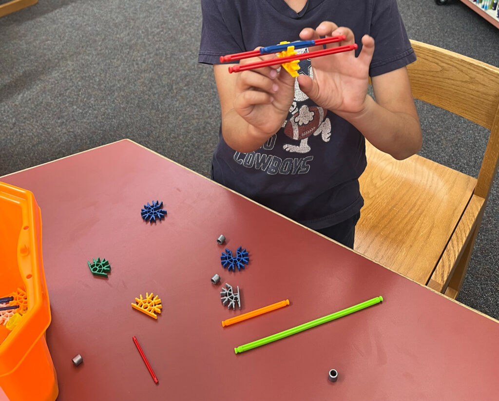 Student exploring with STEAM tools