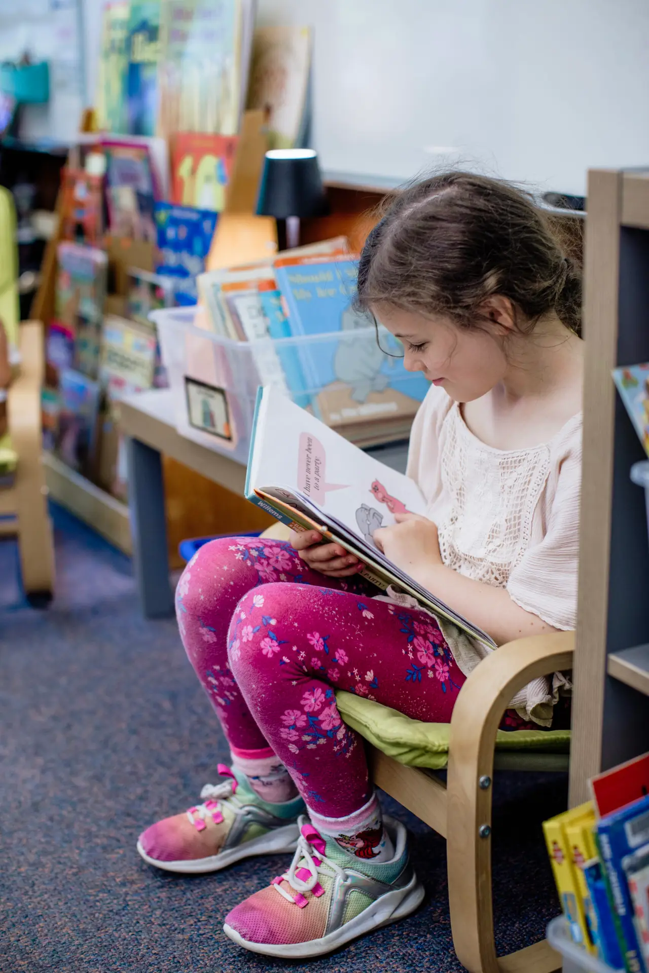 Student reading book supported by Beaverton Education Foundation