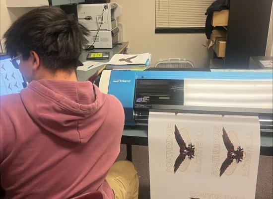 Student in Southridge High School Skyhawks Print Shop