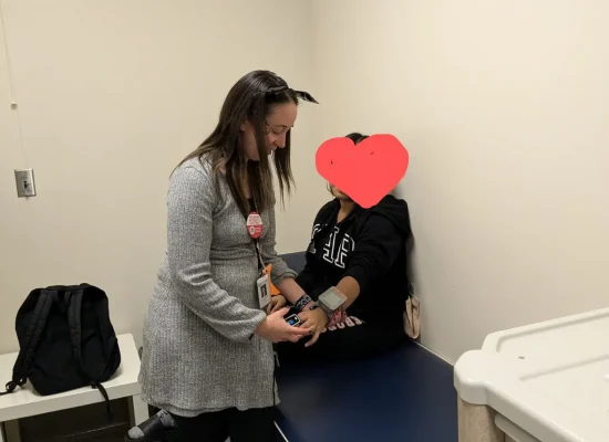 School nurse helping a student