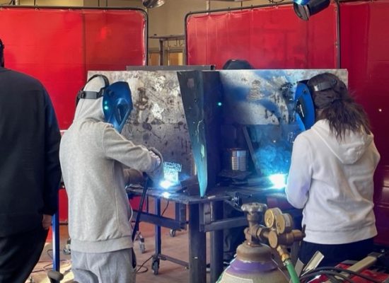 Middle School Students learning welding during Trades Exploration workshops